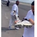 KanyeWest takes off his pair of #Yeezy, gives them to #DJKhaled