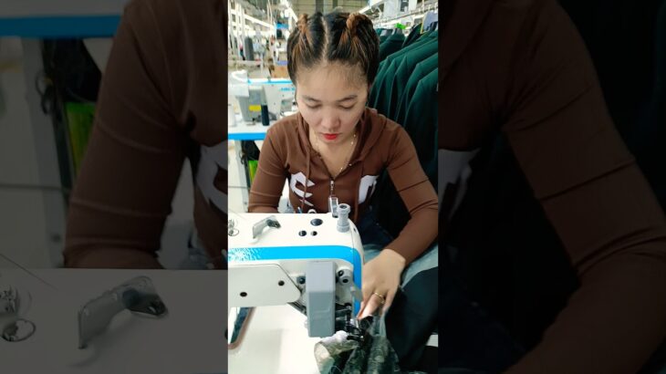 She is Sewing Jacket in Garment Factory