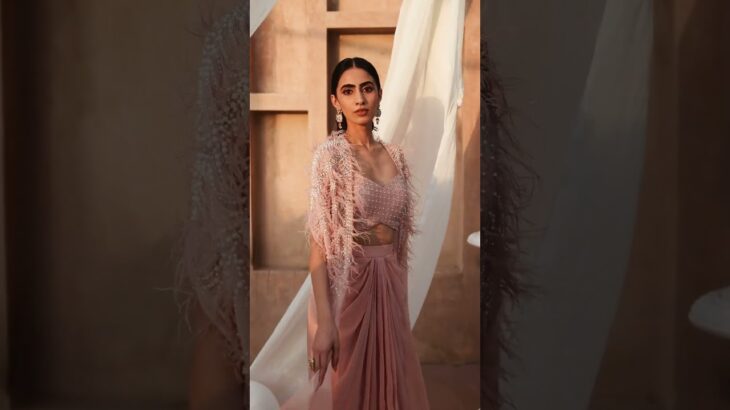 Embrace both style and elegance in this Fringed Long Jacket Set with a Dhoti Skirt