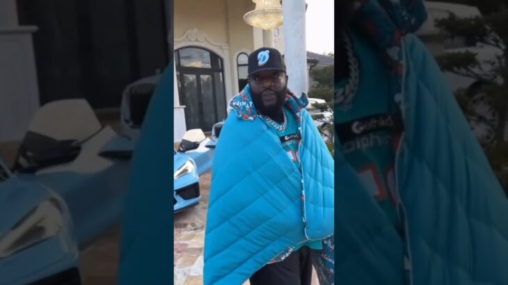 RICK ROSS SHOWS HIS MIAMI DOLPHINS JACKET…..