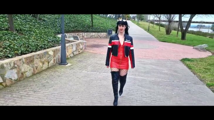 VICTORIA DEVIL- Red leather dress, black high boots and biker jacket.
