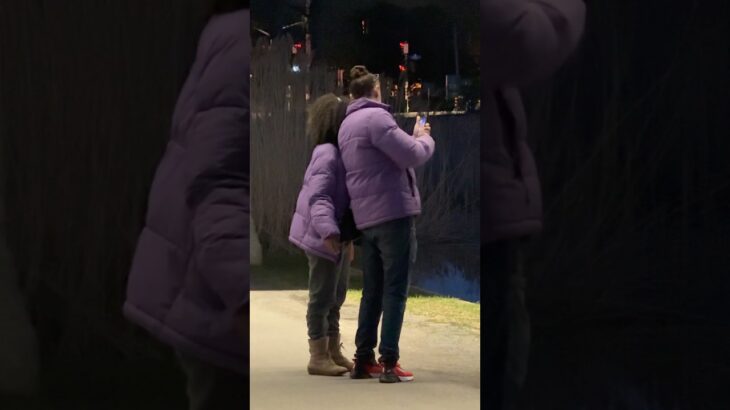 Couple wearing same jacket