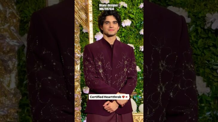 “Elegant maroon open jacket with intricate handwork, paired with Armani machine-fit pants —